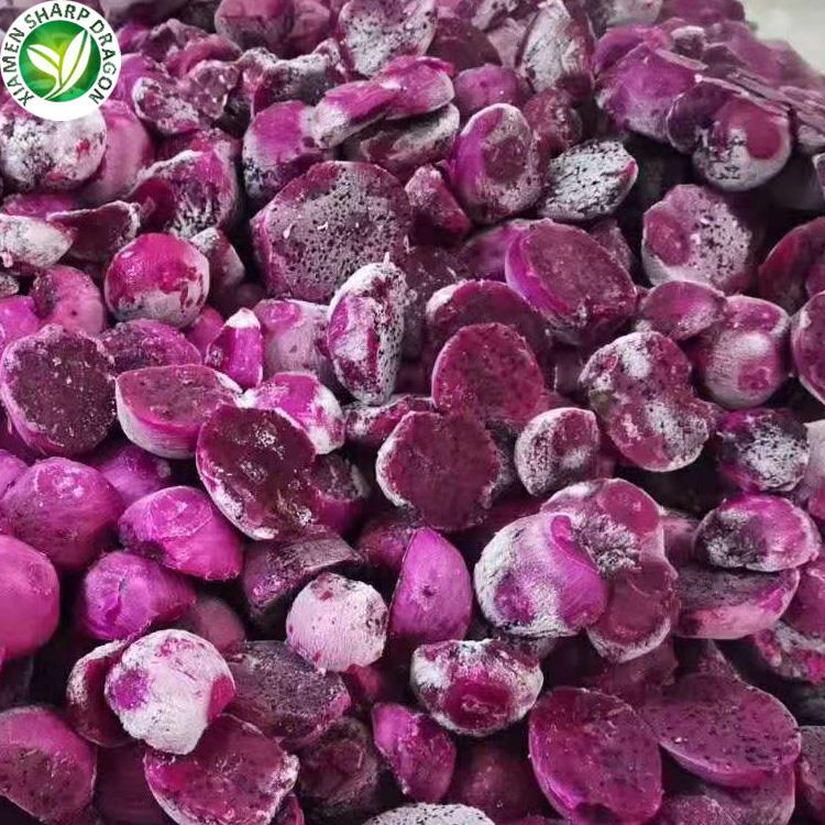 Frozen red pitaya pieces showing magenta flesh frost and black seeds